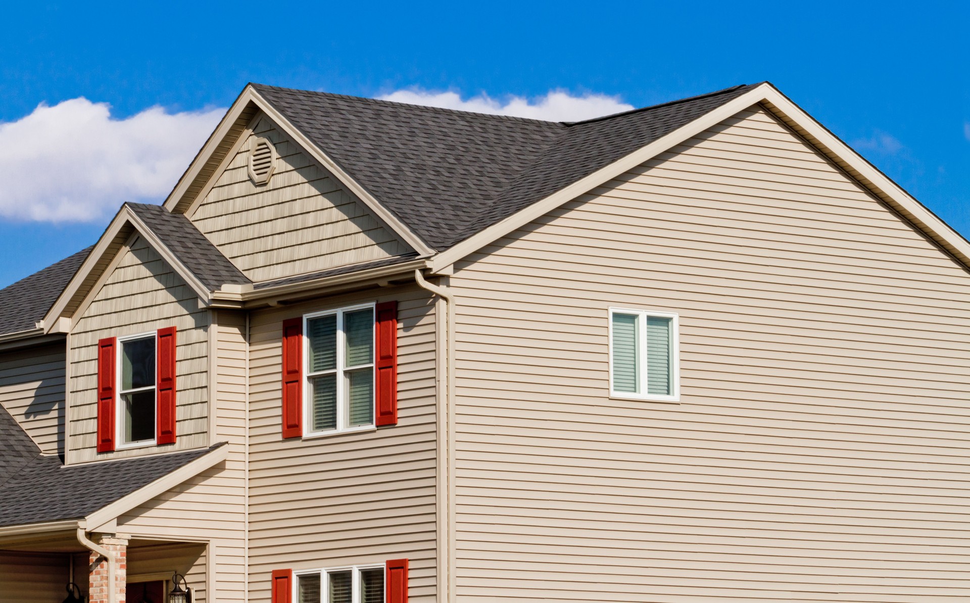 New Home with vinyl siding, gutters and shutters